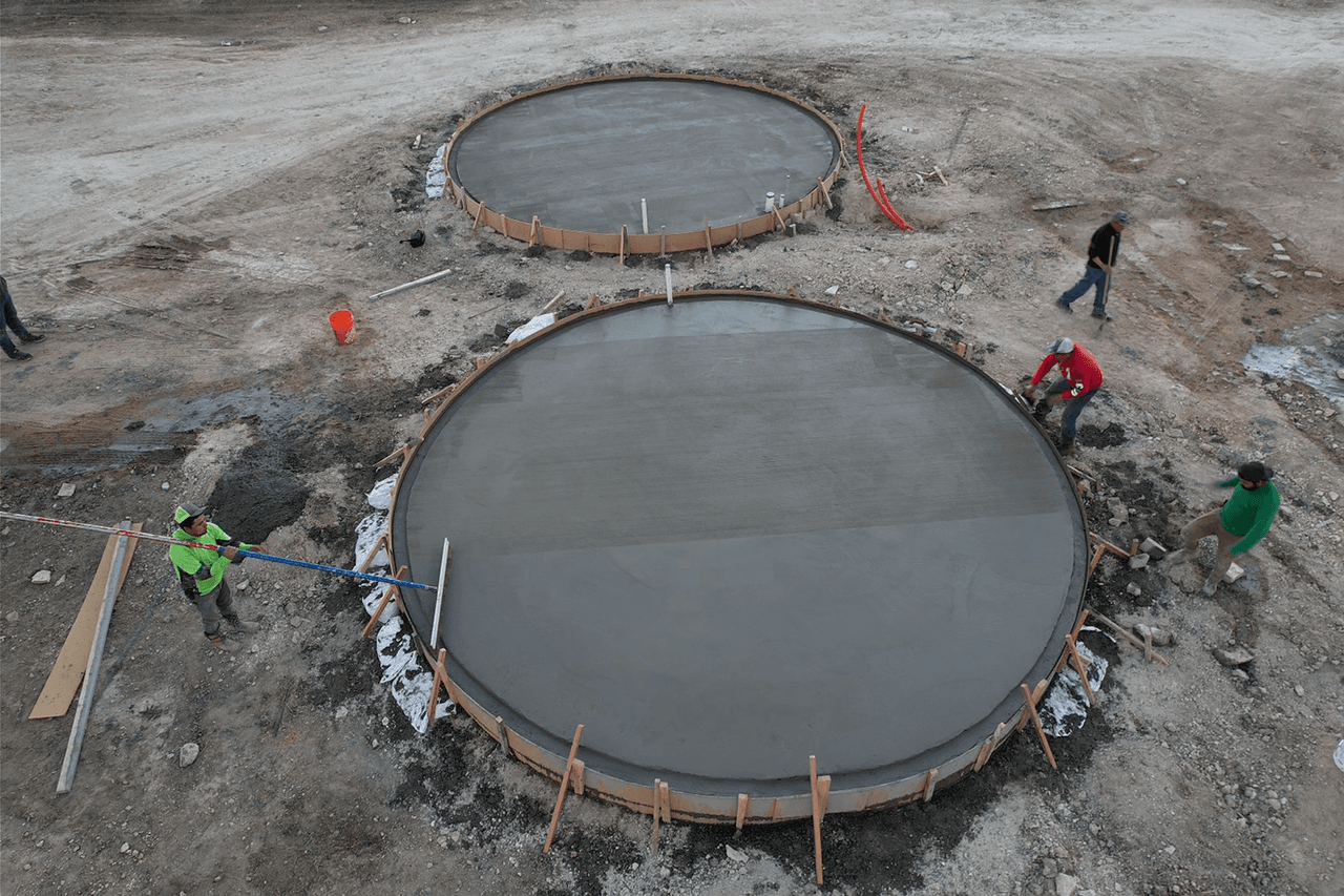 Two large round reinforced concrete slabs formed and poured side by side